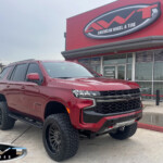 Red 2022 Chevrolet Tahoe with 6" Rough Country Lift on 22x12 Grid Off-Road GF19 wheels & 325/50R22 Toyo Tires Red 2022 Chevrolet Tahoe with 6" Rough Country Lift on 22x12 Grid Off-Road GF19 wheels & 325/50R22 Toyo Tires