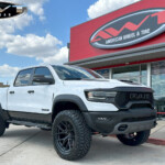 White 2023 Dodge Ram 1500 TRX with ReadyLift Level on 22x10 Vossen Hybrid Forged HF6-4 Wheels and 37x12.50R22 Nitto Ridge Grappler Tires White 2023 Dodge Ram 1500 TRX with ReadyLift Level on 22x10 Vossen Hybrid Forged HF6-4 Wheels and 37x12.50R22 Nitto Ridge Grappler Tires