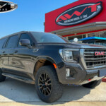 Black 2023 GMC Yukon AT4 with 3" Readylift Lift on Black Powder Coated Factory Wheels & 295/60R20 Toyo Open Country A/T III Tires Black 2023 GMC Yukon AT4 with 3" Readylift Lift on Black Powder Coated Factory Wheels & 295/60R20 Toyo Open Country A/T III Tires