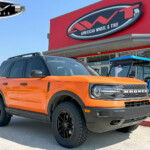 Orange Wrapped Ford Bronco Sport with Eibach Lift on 17x8 Petrol P5C Wheels in Matte Black & 245/65R17 Toyo Open Country A/T III Tires Orange Wrapped Ford Bronco Sport with Eibach Lift on 17x8 Petrol P5C Wheels in Matte Black & 245/65R17 Toyo Open Country A/T III Tires