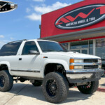 White Chevrolet Tahoe OBS with 6" Rough Country Lift on 20x10 Ballistic 964 Wheels in Gloss Black Milled & 35x12.50R20 Venom Power Terra Hunter X/T Tires White Chevrolet Tahoe OBS with 6" Rough Country Lift on 20x10 Ballistic 964 Wheels in Gloss Black Milled & 35x12.50R20 Venom Power Terra Hunter X/T Tires