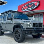 Gray 2023 Mercedes G-Wagon G63 with Eurowise Lift on 285/50R22 Toyo Open Country A/T III Tires Gray 2023 Mercedes G-Wagon G63 with Eurowise Lift on 285/50R22 Toyo Open Country A/T III Tires