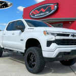 White 2023 Chevrolet Silverado 1500 with 6" Rough Country Lift on 20x10 Fuel Off-Road Lockdown Wheels & 35" Nitto Tires White 2023 Chevrolet Silverado 1500 with 6" Rough Country Lift on 20x10 Fuel Off-Road Lockdown Wheels & 35" Nitto Tires