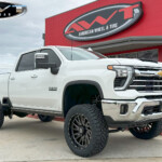 White 2024 Chevrolet Silverado HD 3500 with 5" Rough Country Lift on 22x10 TIS Offroad 547BM Wheels & 35x12.50R22 Nitto Ridge Grappler Tires White 2024 Chevrolet Silverado HD 3500 with 5" Rough Country Lift on 22x10 TIS Offroad 547BM Wheels & 35x12.50R22 Nitto Ridge Grappler Tires