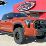 Orange Toyota Tundra with 2.5" Wescott Designs Lift on 18" Lexani XVR-1 Off-Road Karma 6 Wheels & 35x12.50R18 BFGoodrich All-Terrain T/A KO2 Tires Orange Toyota Tundra with 2.5" Wescott Designs Lift on 18" Lexani XVR-1 Off-Road Karma 6 Wheels & 35x12.50R18 BFGoodrich All-Terrain T/A KO2 Tires