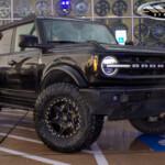 Black Ford Bronco with 2" Rough Country Lift on 18" Lexani XVR-1 Off-Road Karma-6 Wheels & 35x12.50R18 Nitto Ridge Grappler Tires Black Ford Bronco with 2" Rough Country Lift on 18" Lexani XVR-1 Off-Road Karma-6 Wheels & 35x12.50R18 Nitto Ridge Grappler Tires