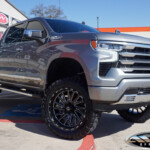 SIlver 2024 Chevrolet Silverado 1500 with 6" Rough Country Lift on 22" TIS Offroad 547BM Wheels & 35x12.50R22 Toyo Open Country M/T Tires SIlver 2024 Chevrolet Silverado 1500 with 6" Rough Country Lift on 22" TIS Offroad 547BM Wheels & 35x12.50R22 Toyo Open Country M/T Tires
