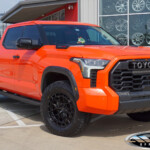 Orange Toyota Tundra TRD PRO with 2.5" Wescott Designs Lift on 20" Vossen HFX-1 Wheels & 35x11.50R20 Falken Wildpeak A/T4W Tires Orange Toyota Tundra TRD PRO with 2.5" Wescott Designs Lift on 20" Vossen HFX-1 Wheels & 35x11.50R20 Falken Wildpeak A/T4W Tires