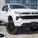 White 2024 Chevrolet Silverado 1500 with 6" Rough Country Lift on 22" TIS Offroad 547B Wheels & Venom Power Terra Hunter X/T Tires White 2024 Chevrolet Silverado 1500 with 6" Rough Country Lift on 22" TIS Offroad 547B Wheels & Venom Power Terra Hunter X/T Tires
