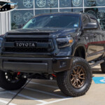 Black 2014 Toyota Tundra with Lift on 20x9 Fuel Off-Road D681 Rebel 5 Wheels in Bronze & 37x12.50R20 BFGoodrich All-Terrain T/A Tires
