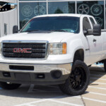 White 2012 GMC Sierra 2500 with ReadyLift Level on 22x10 TIS Offroad 544B Wheels in Gloss Black & 33" Venom Power Terra Hunter X/T Tires