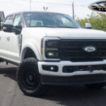 White 2024 Ford F250 with Two Tone Chrome Delete / Blackout on 20" 20x9 Black Rhino Sentinel Wheels & 35" Toyo Open Country A/T III Tires White 2024 Ford F250 with Two Tone Chrome Delete / Blackout on 20" 20x9 Black Rhino Sentinel Wheels & 35" Toyo Open Country A/T III Tires